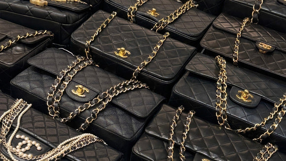 Black Chanel Classic Flap bags with gold CC turn-locks and chain straps.