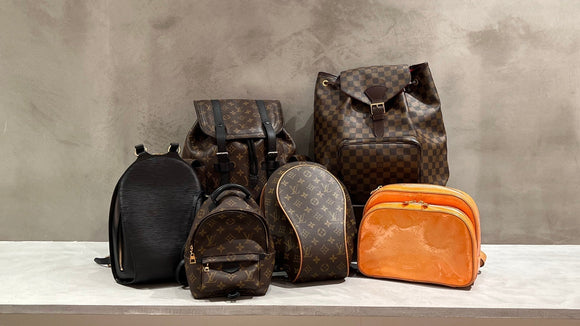 Louis Vuitton backpacks in Monogram canvas, Damier, Epi leather, and orange Vernis.
