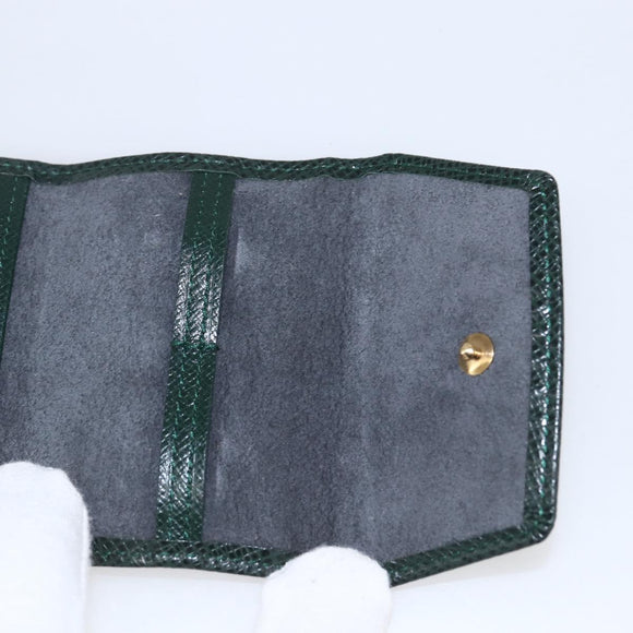 LOUIS VUITTON Taiga Buton De Manchette Cuffs metal Gold Tone LV Auth 156221