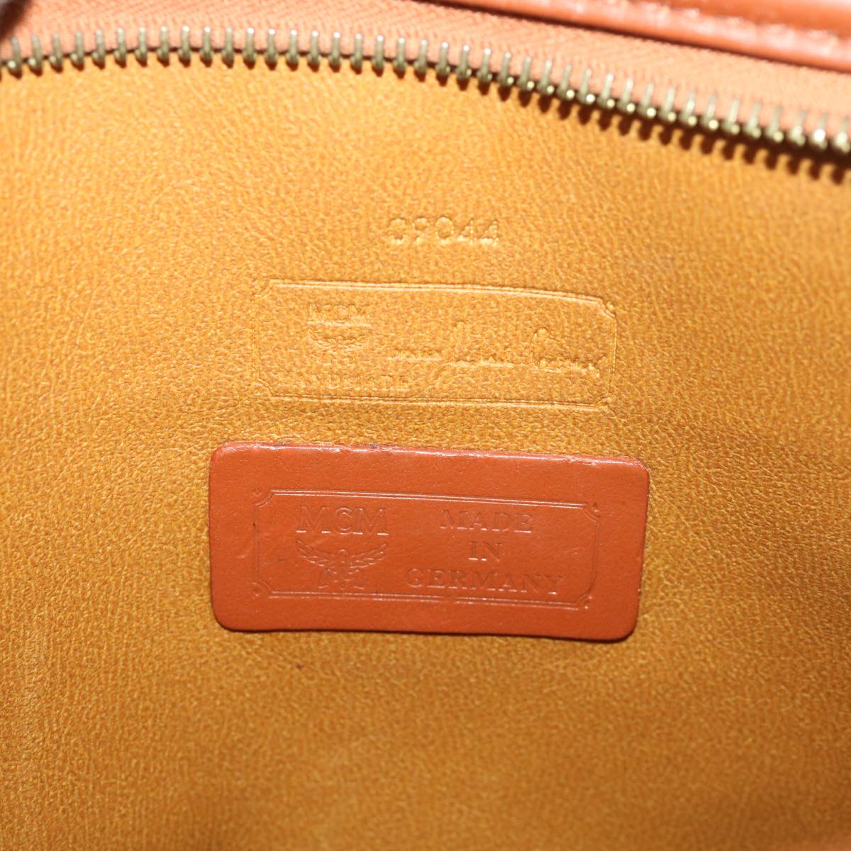 MCM Vicetos Logogram Clutch Bag PVC Leather Orange Auth 39452